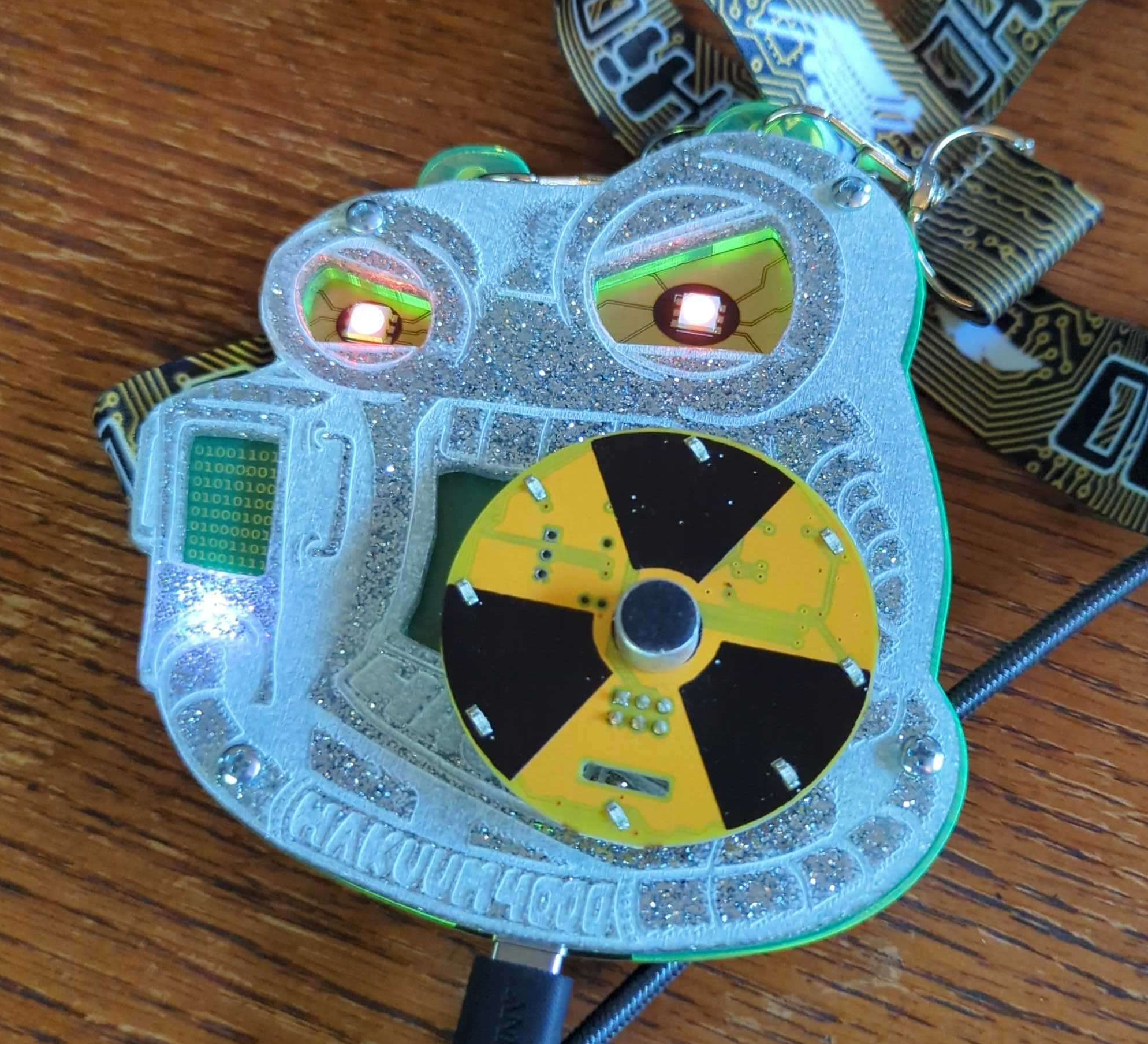 Sparkley diamond face plate badge, possibly a resin mixed with sparkles then CNCed details