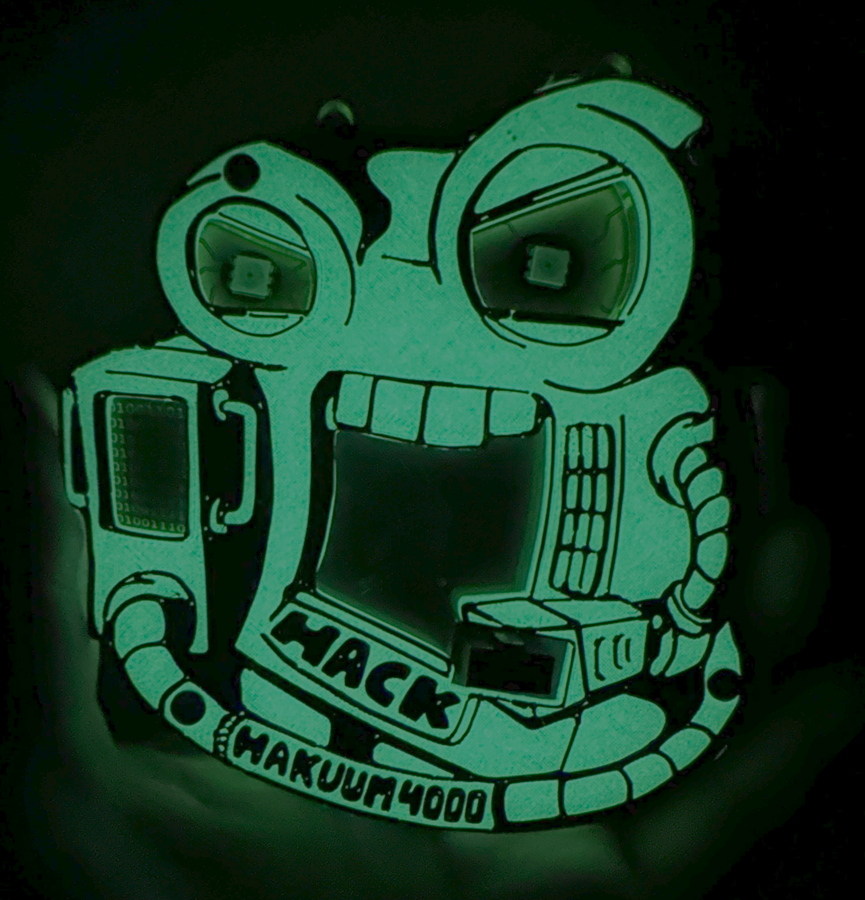 Glow in the dark filament badge shining brightly in pitch black.