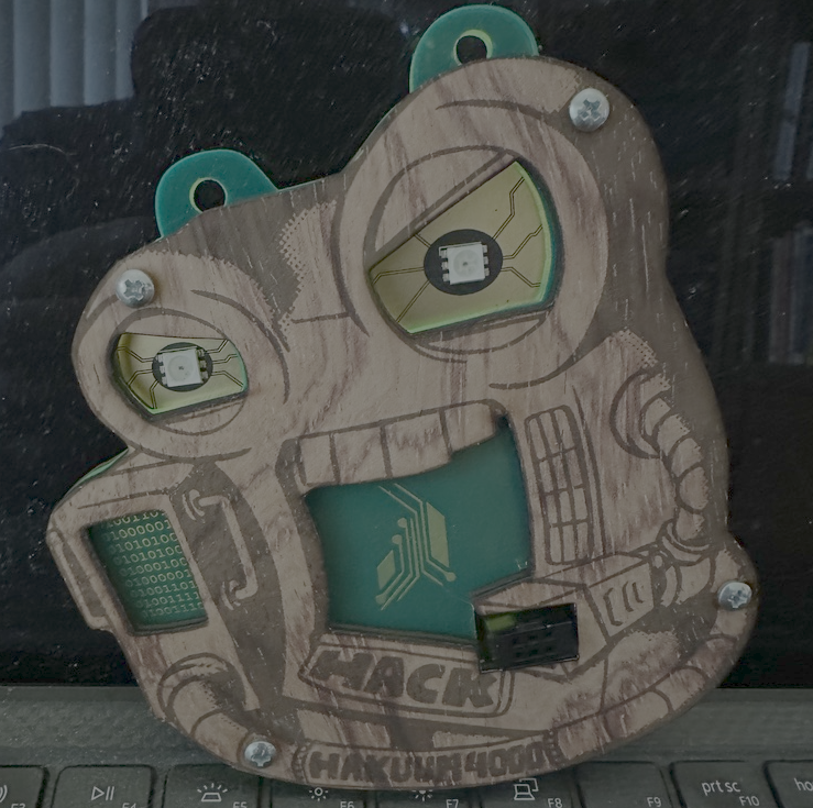 Wooden face plate badge, laser cut wood with burned in details