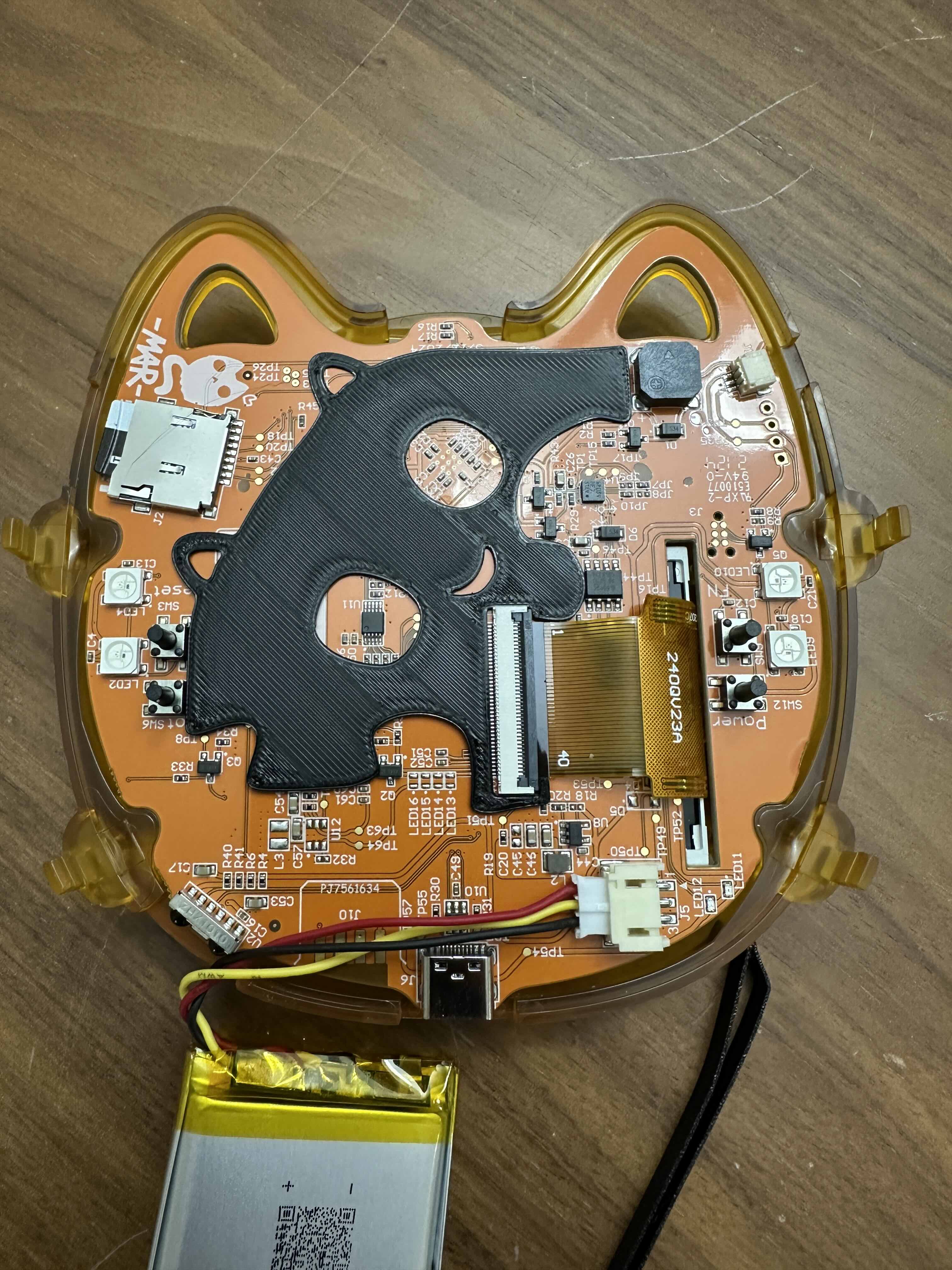 Yellow vendor badge showing battery riser resting on board..