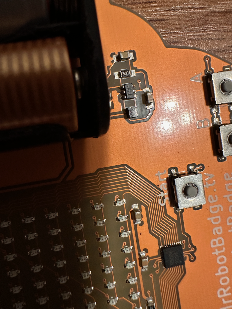 Close up of battery holder and power adaptor chip