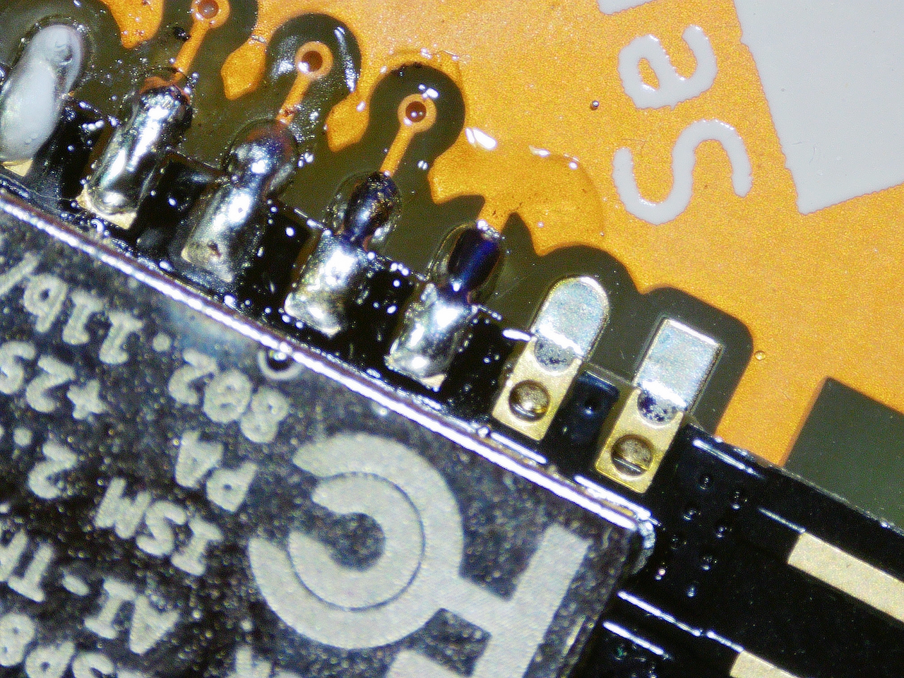 Extreme macro shot showing fixed solder pins.